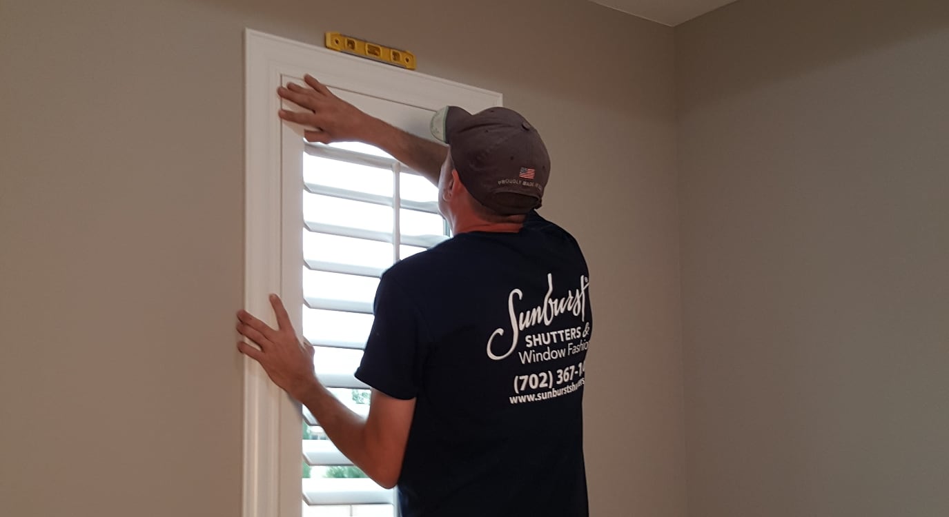 Installer putting in custom plantation shades